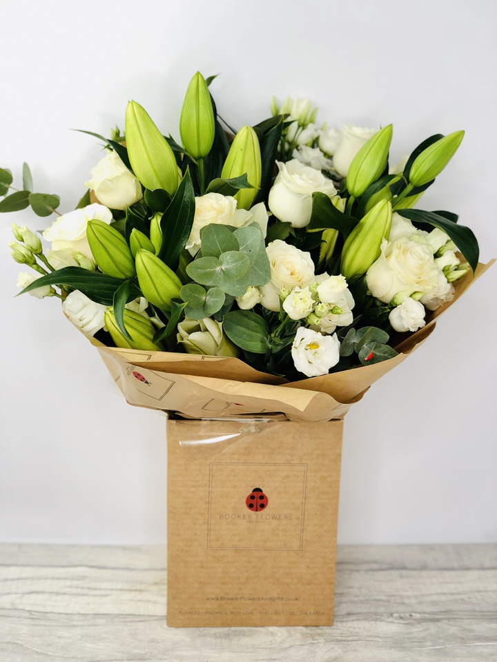 <h2>Classic White and Green Bouquet - Sympathy Flowers</h2>
<br>
<ul>
<li>Approximate Dimensions: 50cm x 50cm</li>
<li>Flowers arranged by hand and gift wrapped in our signature eco-friendly packaging and finished off with a hidden wooden ladybird</li>
<li>To give you the best occasionally we may make substitutes</li>
<li>Our flowers backed by our 7 days freshness guarantee</li>
<li>For delivery area coverage see below</li>
</ul>
<br>
<h2>Flower Delivery Coverage</h2>
<p>Our shop delivers flowers to the following Liverpool postcodes L1 L2 L3 L4 L5 L6 L7 L8 L11 L12 L13 L14 L15 L16 L17 L18 L19 L24 L25 L26 L27 L36 L70 If your order is for an area outside of these we can organise delivery for you through our network of florists. We will ask them to make as close as possible to the image but because of the difference in stock and sundry items it may not be exact.</p>
<br>
<h2>Hand-tied Bouquet | Sympathy Flowers</h2>
<p>These classic white and green beautiful flowers hand-arranged by our professional florists into a hand-tied bouquet make the perfect sympathy flowers. This beautiful selection includes classic roses and fragrant oriental lilies with pretty lisianthus. This classic white and green hand-tied bouquet is rich with texture and detail and the lilies add a beautiful sweet scent.</p>
<p>Handtied bouquets are a lovely display of fresh flowers that have the wow factor. The advantage of having a bouquet made this way is that they are artfully arranged by our florists and tied so that they stay in the display.</p>
<p>They are then gift wrapped and aqua packed in a water bubble so that at no point are the flowers out of water. This means they look their very best on the day they arrive and continue to delight for days after.</p>
<p>Being delivered in a transporter box and in water means the recipient does not need to put the flowers in a vase straight away they can just put them down and enjoy.</p>
<p>Featuring 3 white oriental, 11 white roses, and 4 white lisianthus, together with mixed seasonal foliage including eucalyptus.</p>
<br>
<h2>Eco-Friendly Liverpool Florists</h2>
<p>As florists we feel very close earth and want to protect it. Plastic waste is a huge problem in the florist industry so we made the decision to make our packaging eco-friendly.</p>
<p>To achieve this we worked with our packaging supplier to remove the lamination off our boxes and wrap the tops in an Eco Flowerwrap which means it easily compostable or can be fully recycled.</p>
<p>Once you have finished enjoying your flowers from us they will go back into growing more flowers! Only a small amount of plastic is used as a water bubble and this is biodegradable.</p>
<p>Even the sachet of flower food included with your bouquet is compostable.</p>
<p>All our bouquets have small wooden ladybird hidden amongst them so do not forget to spot the ladybird and post a picture on our social media pages to enter our rolling competition.</p>
<br>
<h2>Flowers Guaranteed for 7 Days</h2>
<p>Our 7-day freshness guarantee should give you confidence that we will only send out good quality flowers.</p>
<p>Leave it in our hands we will create a marvellous bouquet which will not only look good on arrival but will continue to delight as the flowers bloom.</p>
<br>
<h2>Liverpool Flower Delivery</h2>
<p>We are open 7 days a week and offer advanced booking flower delivery same-day flower delivery 3-hour flower delivery. Guaranteed AM PM or Evening Flower Delivery and also offer Sunday Flower Delivery.</p>
<p>Our florists deliver in Liverpool and can provide flowers for you in Liverpool Merseyside. And through our network of florists can organise flower deliveries for you nationwide.</p>
<br>
<h2>The Best Florist in Liverpool your local Liverpool Flower Shop</h2>
<p>Come to Booker Flowers and Gifts Liverpool for your beautiful flowers and plants. For that bit of extra luxury we also offer a lovely range of finishing touches such as wines champagne locally crafted Gin and Rum Vases Scented Candles and Chocolates that can be delivered with your flowers.</p>
<p>To see the full range see our extras section.</p>
<p>You can trust Booker Flowers and Gifts of delivery the very best for you.</p>
<p><br /><br /></p>
<p><em>5 Star review on Yell.com</em></p>
<br>
<p><em>Thank you Gemma for your fabulous service. The flowers are of the highest quality and delivered with a warm smile. My sister was delighted. Ordering was simple and the communications were top-notch. I will definitely use your services again.</em></p>
<br>